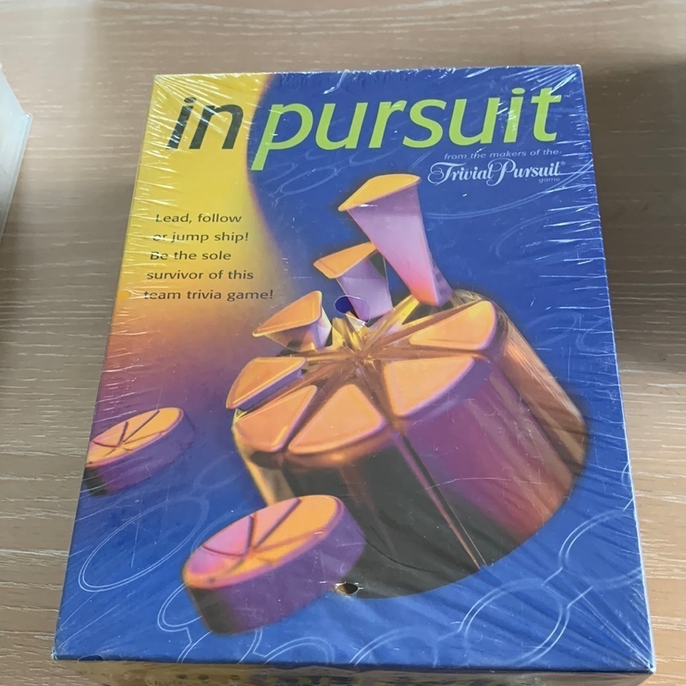 In Pursuit from the Makers of Trivial Pursuit, 4-8 players, still new in package